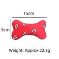 Red plush bone dog toy with white heart patterns, squeaky chew toy sized 15cm x 9cm - Red Heart Bone