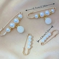 Set of gold finish pearl safety pins in two sizes on champagne silk background - No. 29 Dangle Berry 4-Piece Set