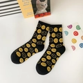 Mid-cut black cotton socks with yellow smiley face patterns and SMILE bubble text - One Size / Black All-over Smiley