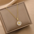 Golden titanium steel sunflower necklace with sparkling white zircon petals on jewelry box - Gold