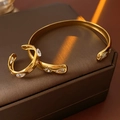 Detail of gold-plated bangle and ring set with teardrop marquise cubic zirconia - Gold Bracelet And Ring Set