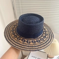 Navy blue and natural woven boater hat with flat top and wide brim for sun protection - Raffia Hollow Indented Hat - Navy Blue