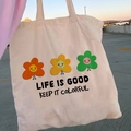 Beige canvas tote bag with colorful retro flower print and Life is Good text - STD874-J Life Is Good