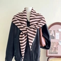 Detail shot of a knotted pink and brown striped wool blend knitted triangular scarf - Coffee and Pink Stripe