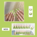 Detail of green French tip press-on nails with white butterfly and star art design - W031 Mustard Green Butterfly
