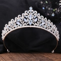 Elegant silver bridal crown with light blue marquise gems and crystals on a wood base - Silver White Rhinestone + Blue Opal