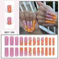 Long trapezoid press-on nails featuring orange French tips and floral glitter designs - SGCY-268 / Glue Type