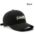 Classic black cotton baseball cap with white letter embroidery and a curved brim - Black