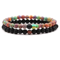 Detail view of 6mm distance bracelets with textured colorful beads and matte black stones - Red Peacock Ore