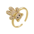Macro shot of gold ring featuring a 3D teddy bear inlaid with sparkling pink rhinestones - Gold Pink Zirconia