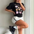 Short sleeve black T-shirt featuring pink shell print and stylish sporty design - S / Black