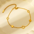 Minimalist gold stainless steel flower bracelet with hollow and solid petal charms - Gold Hollow Flower Bracelet