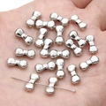 Silver bow-shaped metal alloy charm beads for DIY necklace and bracelet crafting - Bow / 11x5mm