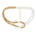 Dual-layer necklace with gold metal beads and white faux pearls in a knotted cross design - Round Pearl / Gold