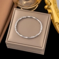 Elegant silver bamboo joint stainless steel bangle displayed in an ornate jewelry gift box - Silver Bamboo Knot Open Bangle