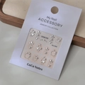 Detailed view of 3D embossed nail stickers with silver metal frames and white pearls - MJ-044 Silver Stamping