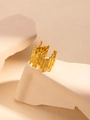 Macro detail of gold titanium steel ring with unique liquid lava texture design - Gold Geometric Lava Ring