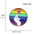 Rainbow enamel pin featuring a k-pop heart sign on a colorful striped circular badge - Rainbow Round Finger Heart Gesture Style (A00716)