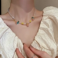 Handmade beaded necklace with colorful stars and heart charms on a female model - Colorful Handmade Glass Beaded Style (24#)