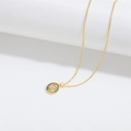 Gold pendant necklace with a circular snake relief and colorful gemstone inlay - Round Snake