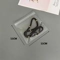 Detail of 11x11cm thickened PVC jewelry zip lock bag with dark beaded bracelet inside - 50 Silk 11x11cm