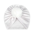 Close-up of soft white velvet baby turban hat with a plush faux fur pompom on top - One Size / White