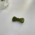 Detailed macro view of olive green bow hair clip with France Handmade gold lettering - Jelly Green - Thickened Bowknot