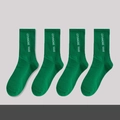 Green checkered crew socks with white embroidery text in a set of four pairs - No.01 Klein Blue Trend Socks