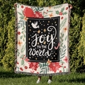 Detailaufnahme der Joy to the World Weihnachts-Strickdecke mit Fransen und Festtagsmotiven - Freude Für Die Welt