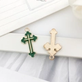 Golden alloy cross pendant with green enamel inlay showing front and back views - Cross