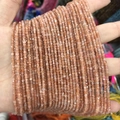 Strands of 2-3mm square natural stone beads in a vibrant orange-pink crystal hue - 45-Sunstone (Natural)