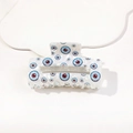 Detail of white acetate hair claw clip featuring blue and red eye print pattern - 8.5cm Square Evil Eye - Model D