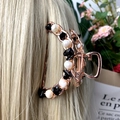 Rose gold crescent hair claw clip featuring elegant white pearls and black stone beads - Obsidian + Deep Sea Pearl Rose Gold Hair Claw