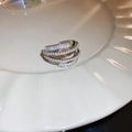 Detail of silver multi-layer crossover ring with sparkling pavé cubic zirconia - 27# Ring - Regular - Silver