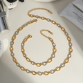 Détail d'un ensemble collier et bracelet en acier inoxydable bicolore or et argent - Collier 40+5cm, Bracelet 17+5cm