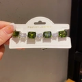 Detail of emerald cut green zircon and oval clear stones on silver-tone bracelet - 38# Bracelet - Silver - Green
