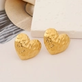 Detailed shot of golden irregular heart earrings with textured hammered finish on a stone pedestal - Hammered Heart Shape (Gold 5)