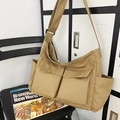 Grote kaki canvas crossbodytas met verstelbare riem en meerdere functionele zakken - Khaki
