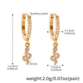 Golden stainless steel snake earrings with zircon pavé detail and 2.4cm height - Huggie Snake Earrings (Q157)