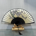 Classic Chinese folding fan with pink cherry blossoms and black hollow frame - Peach Blossoms Abloom