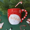 3D Santa Claus ceramic mug with red snowflake pattern and candy cane handle design - Snowflake Santa Mug 370ml