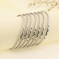 Detail of 7pcs stacked silver bangles with diamond-cut diamond pattern on a display stand - 7 Ring Set / Inner 68mm Width 4mm / Steel Color (KB185429-LO)