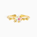 Macro detail of adjustable gold ring featuring iridescent star stone and zircon inlays - Gold