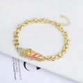 Detailed macro view of 18K gold religious bracelet with San Judas enamel pendant - Gold Saint Jude Orange Enamel