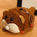 Cute brown plush hamster keychain with soft granular fleece and metal clasp on wood - Otter / 12cm