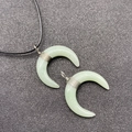 Light green jade crescent moon necklace with wire wrapping on a black cord strap - Green Aventurine