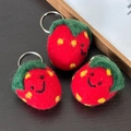 Handmade red wool felt strawberry keychain with cute smiling faces and green leaves - Strawberry