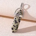 Macro detail of hexagonal Dalmatian Jasper pendant with polished silver alloy clasp - Dalmatian Jasper