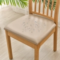 Waterproof PU leather chair seat cover in light brown with water droplets on surface - Khaki