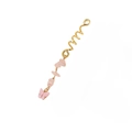 Detailed shot of golden spiral hair ring with pink stone and resin butterfly pendant - Snake Spiral / Pink